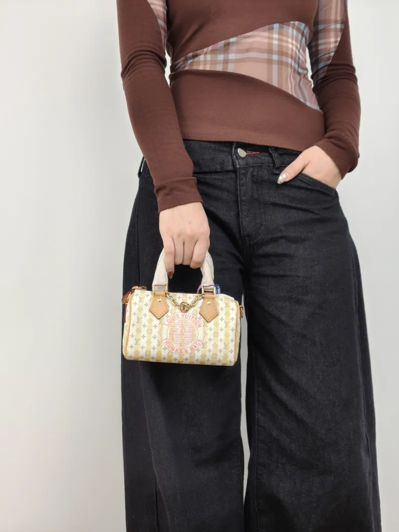 Louis Vuitton Crossbody Bag Speedy Nano White Yellow Monogram PVC nano 16 × 7.5 × 10 cm — on-model view 1 of 3