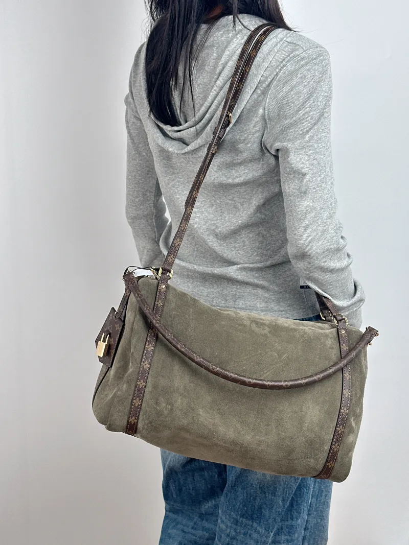 Louis Vuitton Shoulder Bag EXPRESS Shoulder Bag Green Suede Medium 36 × 18.5 × 24 cm — on-model view 1 of 2