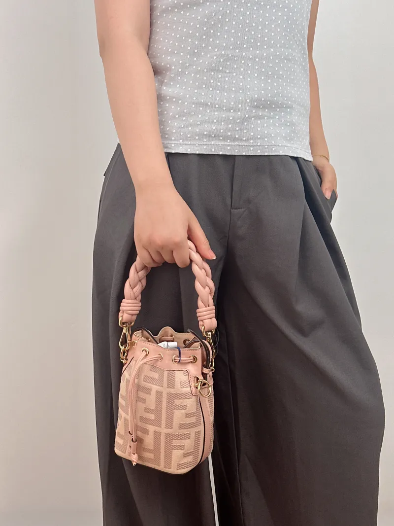 FENDI Crossbody Bag Mon Tresor Bucket Bag Pink Canvas Mini 12 × 10 × 18 cm — on-model view 1 of 2