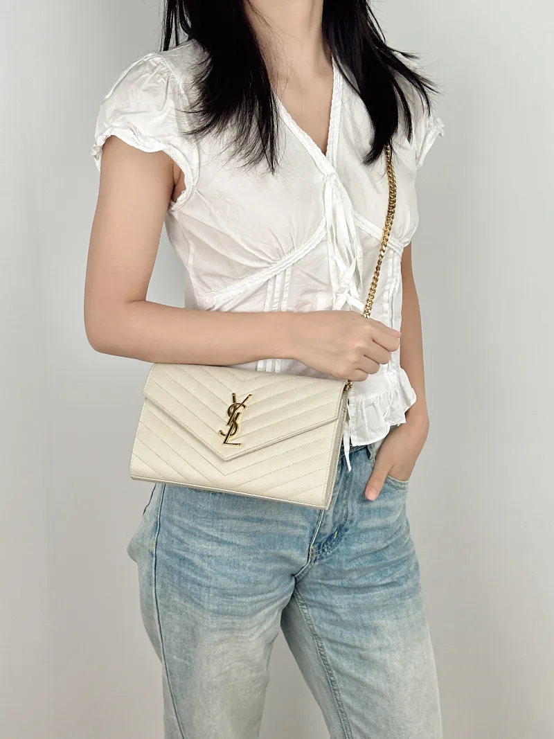 SAINT LAURENT Crossbody Bag CASSANDRE ENVELOPE White Calfskin 22.5 × 4 × 14 cm — on-model view 1 of 2