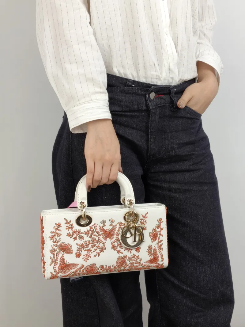 DIOR Shoulder Bag Lady D-Sire Red Embroidered White Red Calfskin Small 26 × 5 × 13 cm — on-model view 2 of 3
