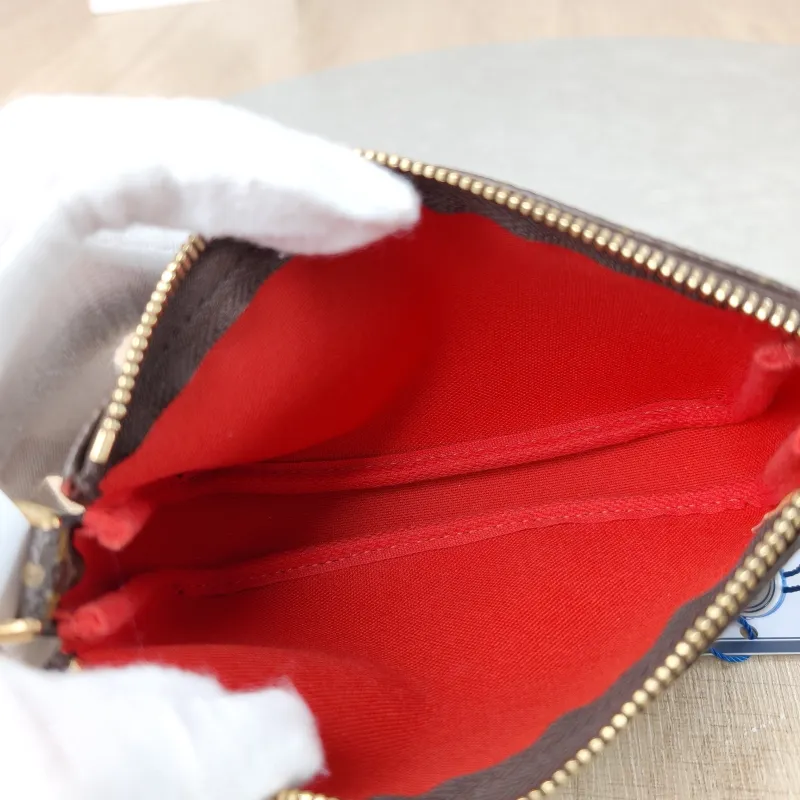 Louis Vuitton Clutch Mini Pochette Accessoires Monogram PVC Mini 15.5 × 4 × 10.5 cm — detail view 1 of 9
