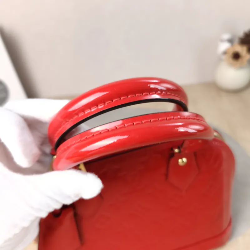Louis Vuitton Crossbody Bag Alma BB Patent Leather BB 23.5 × 11.5 × 17.5 cm — detail view 1 of 11