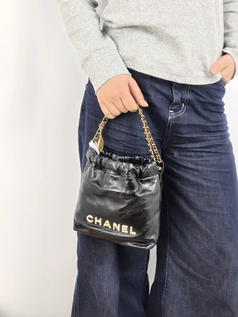 Chanel Shoulder Bag 22Bag Black CC alfskin Mini 20 × 6 × 19 cm — on-model view 1 of 2