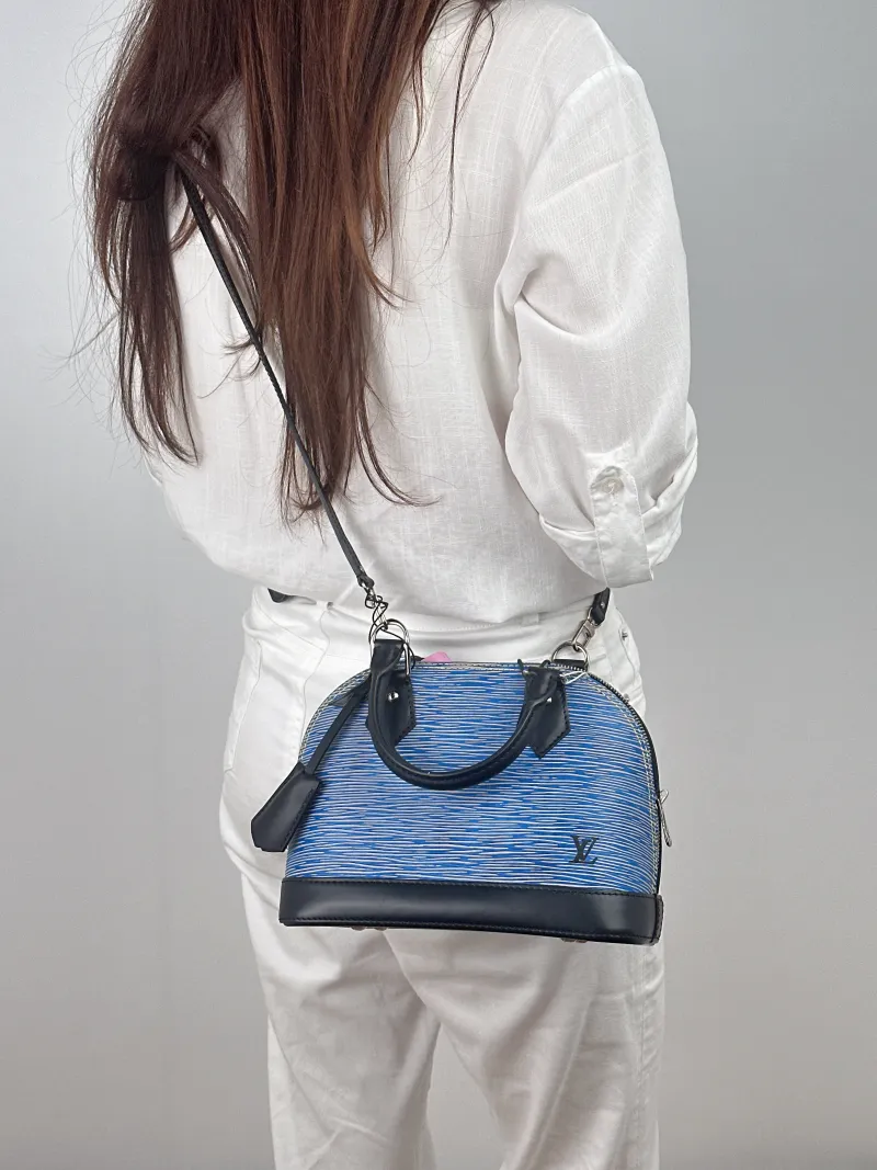 Louis Vuitton Top Handle Bag Alma BB Blue Epi Embossed Calfskin BB 23.5 × 11.5 × 17.5 cm — on-model view 2 of 2