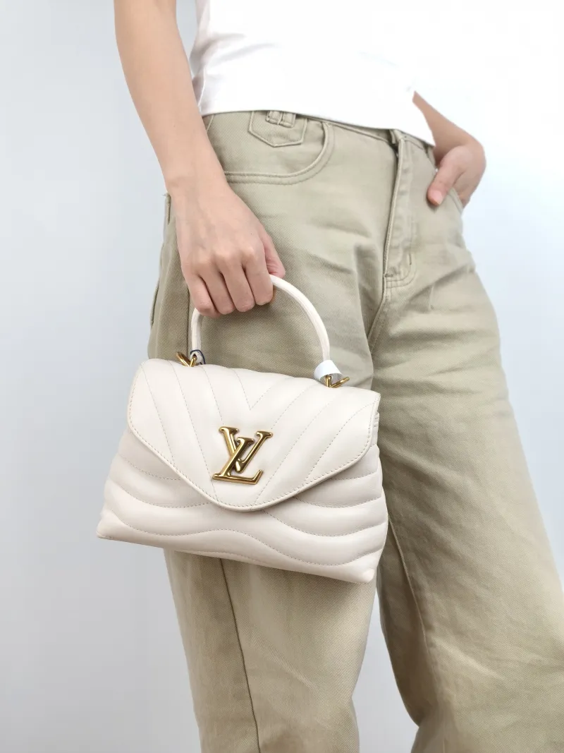 Louis Vuitton Crossbody Bag New Wave Hold Me Top Handle Bag White Calfskin One Size 23 × 10 × 15 cm — on-model view 1 of 3