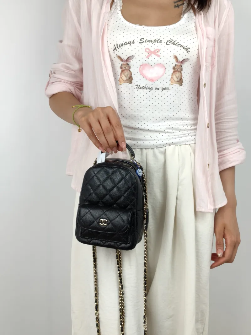 Chanel Backpack mini Backpack Collection Black with Gold-Tone Hardware Grained Calfskin One Size 13 × 9 × 18 cm — on-model view 3 of 3