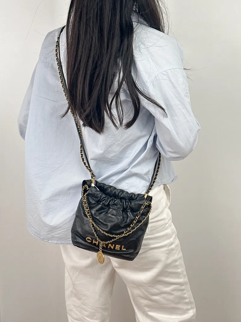 Chanel Shoulder Bag 22Bag Black CC alfskin Mini 20 × 6 × 19 cm — on-model view 1 of 2