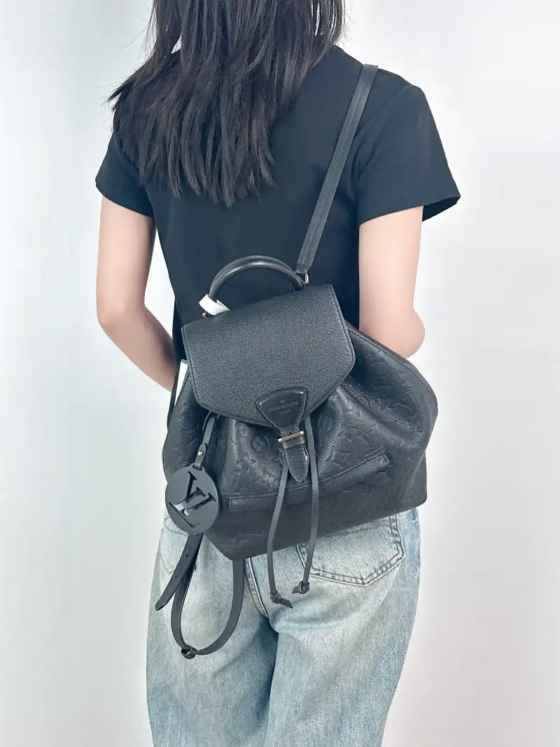 Louis Vuitton Backpack Montsouris Backpack Black Monogram Empreinte Embossed Calfskin Small 27.5 × 14 × 33 cm — on-model view 1 of 3