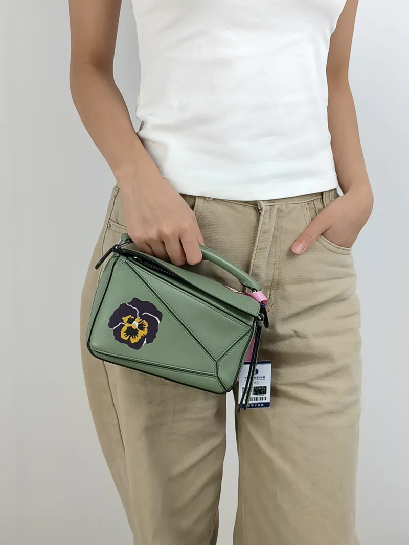 LOEWE Crossbody Bag Puzzle Green Calfskin Mini 18 × 8 × 12.5 cm — on-model view 3 of 3
