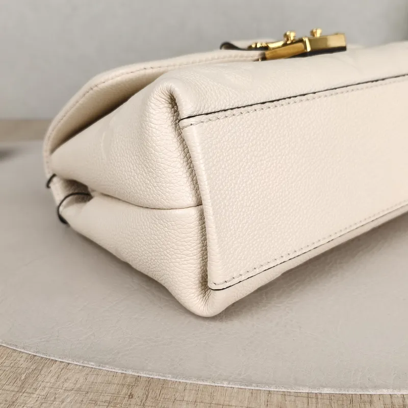 Louis Vuitton Crossbody Bag MADELEINE White Monogram Empreinte Embossed Calfskin BB 24 × 8.5 × 17 cm — detail view 7 of 14