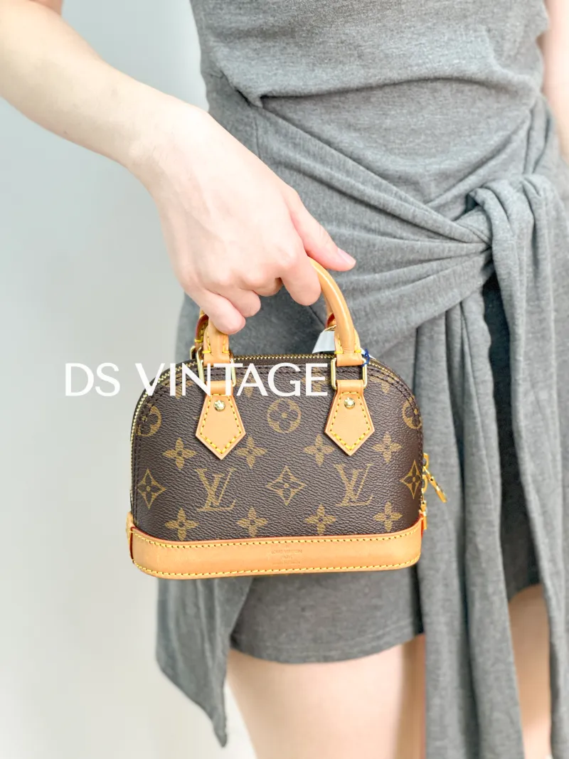 Louis Vuitton Crossbody Bag Alma Nano Monogram PVC nano 18 × 8 × 12 cm — on-model view 1 of 3