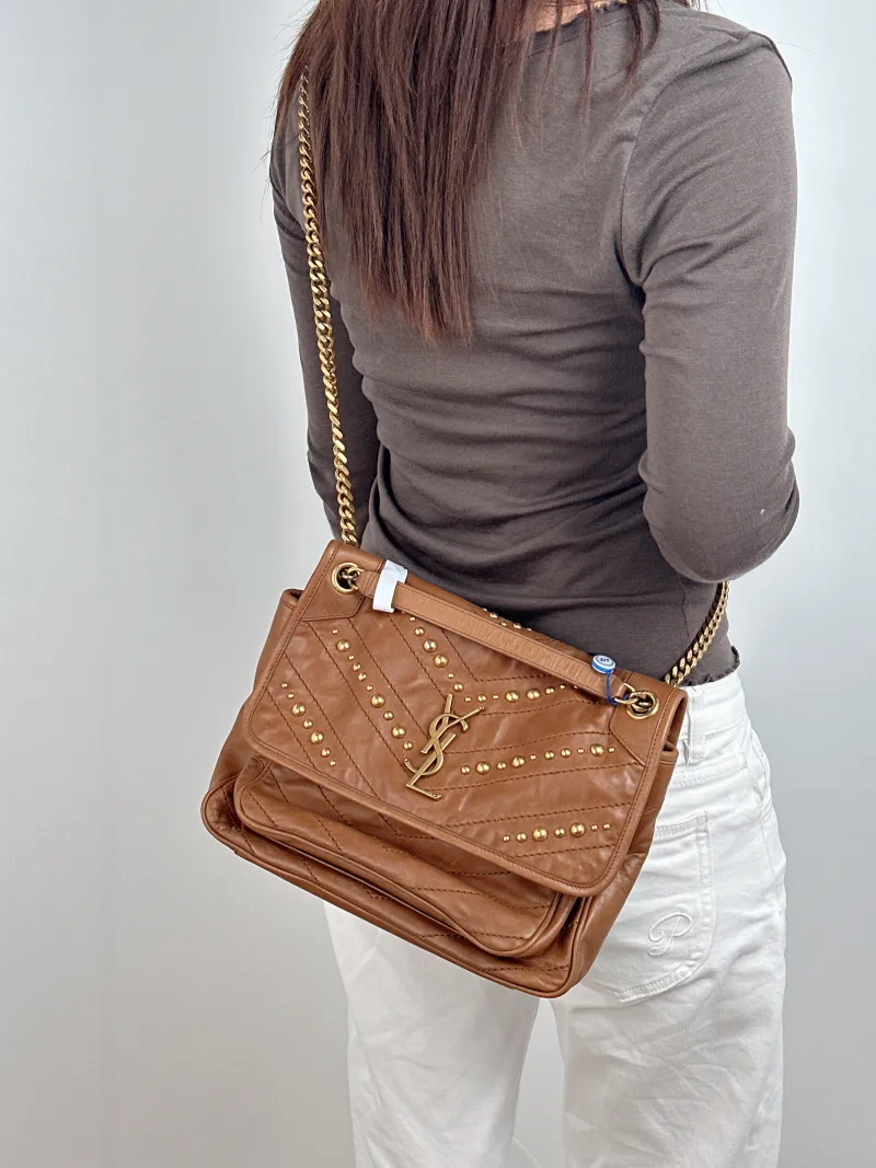 SAINT LAURENT Crossbody Bag Niki Caramel Medium 28 × 8.5 × 20 cm — on-model view 1 of 2