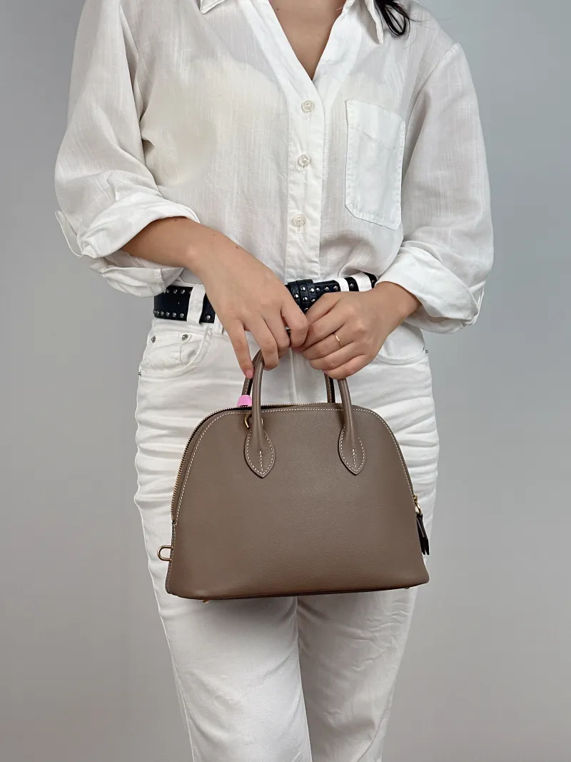Hermès Shoulder Bag Bolide 1923 25Gold-Tone Hardware Top Handle Bag Evercolor Calfskin Small 25 × 11 × 20 cm B — on-model view 1 of 2