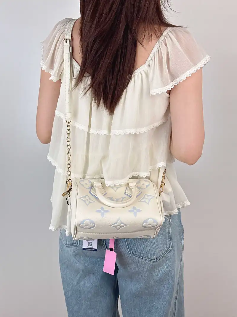 Louis Vuitton Crossbody Bag Speedy20 White · Blue Empreinte Embossed Calfskin Small 20.5 × 12 × 13.5 cm — on-model view 3 of 3