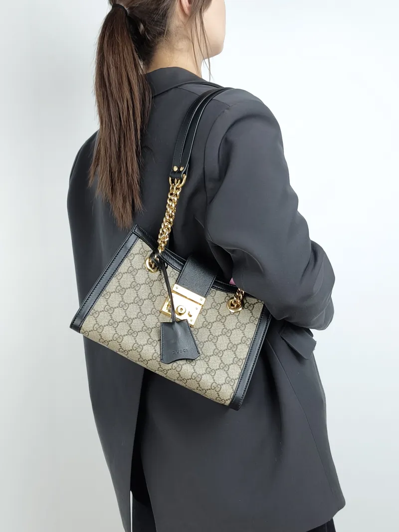 GUCCI Shoulder Bag Padlock Tote Black Monogram PVC Medium 26 × 10 × 18 cm — on-model view 1 of 2