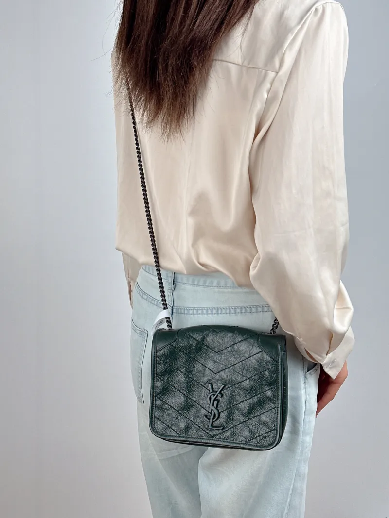 SAINT LAURENT Crossbody Bag Niki Chain Bagwoc Green Calfskin Mini 19 × 5 × 16 cm — on-model view 1 of 2