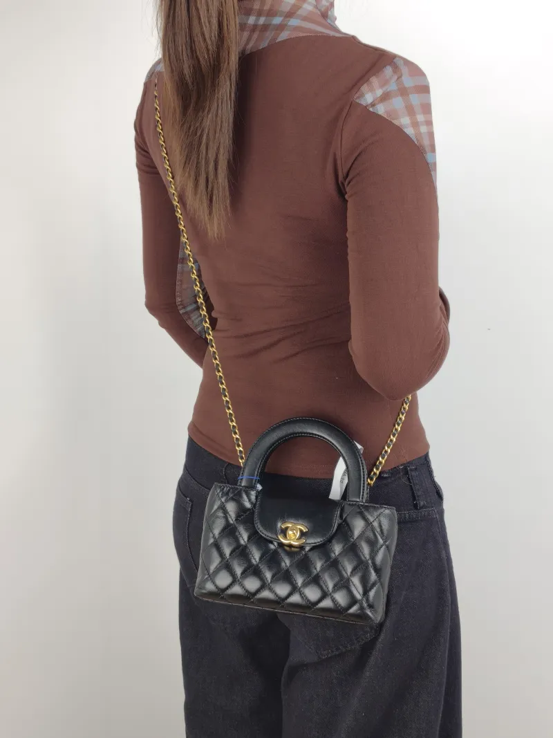 Chanel Shoulder Bag Kelly Black Waxed Leather Small 19 × 7 × 13 cm — on-model view 1 of 3