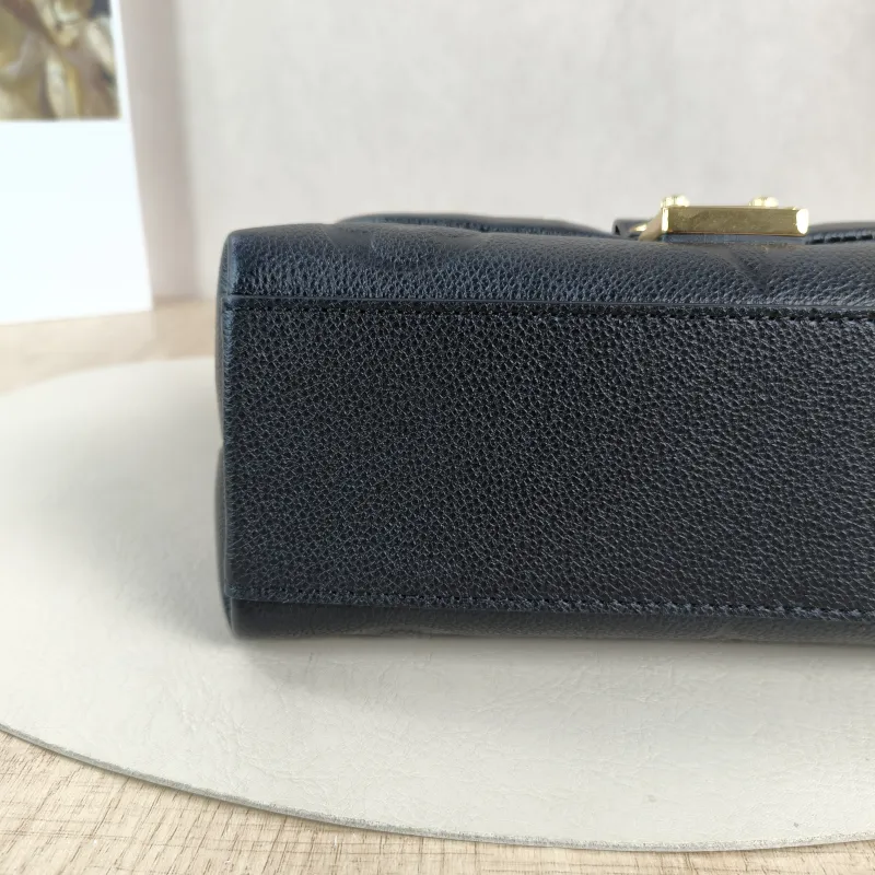 Louis Vuitton Crossbody Bag MADELEINE Black Empreinte Embossed Calfskin BB 24 × 8.5 × 17 cm — detail view 13 of 15