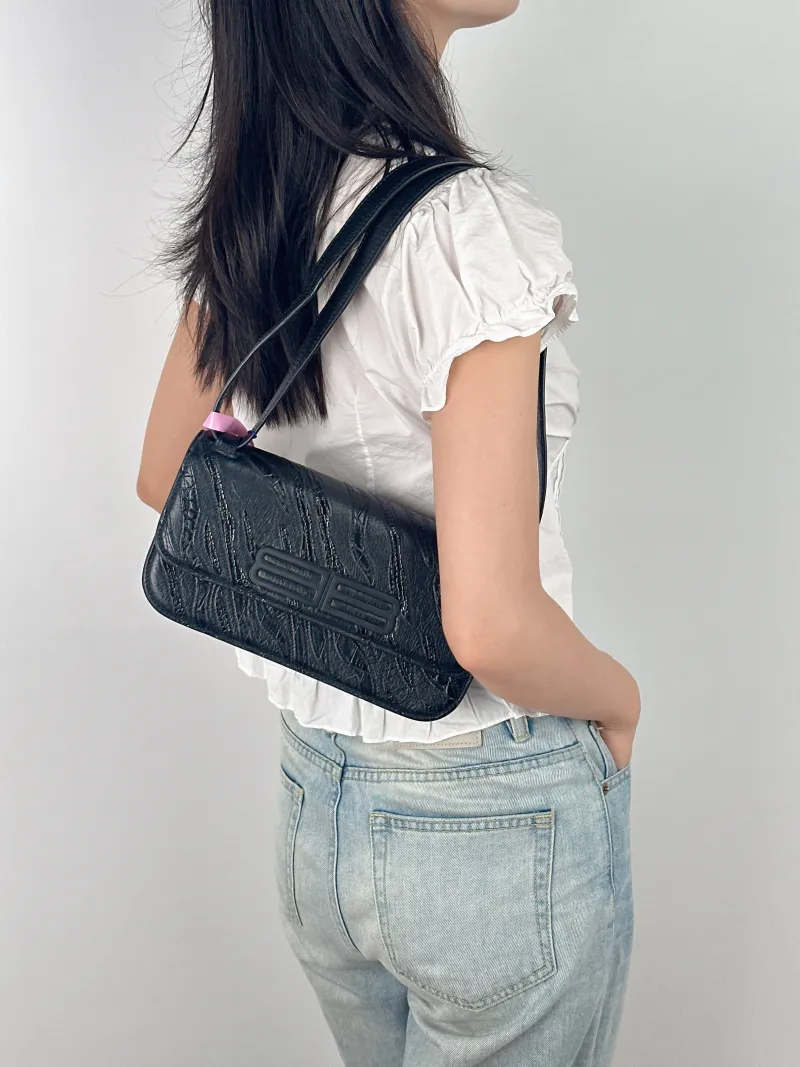 BALENCIAGA Shoulder Bag GOSSIP Black CC alfskin Small 23.5 × 10.5 × 12.5 cm — on-model view 1 of 3