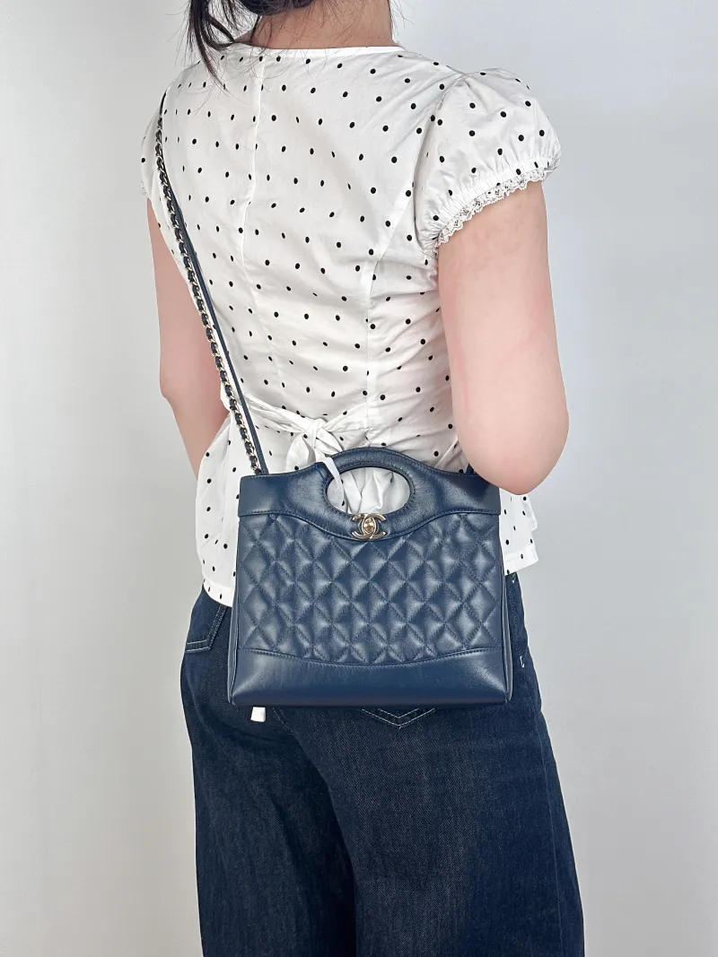 Chanel Crossbody Bag31Bag Navy Waxed Leathermini23 × 5.5 × 22 cm — on-model view 1 of 3