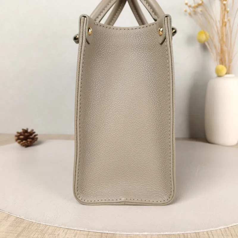 Louis Vuitton Top Handle Bag Onthego Monogram Empreinte Embossed Calfskin Small 25 × 11.5 × 19 cm — detail view 2 of 10