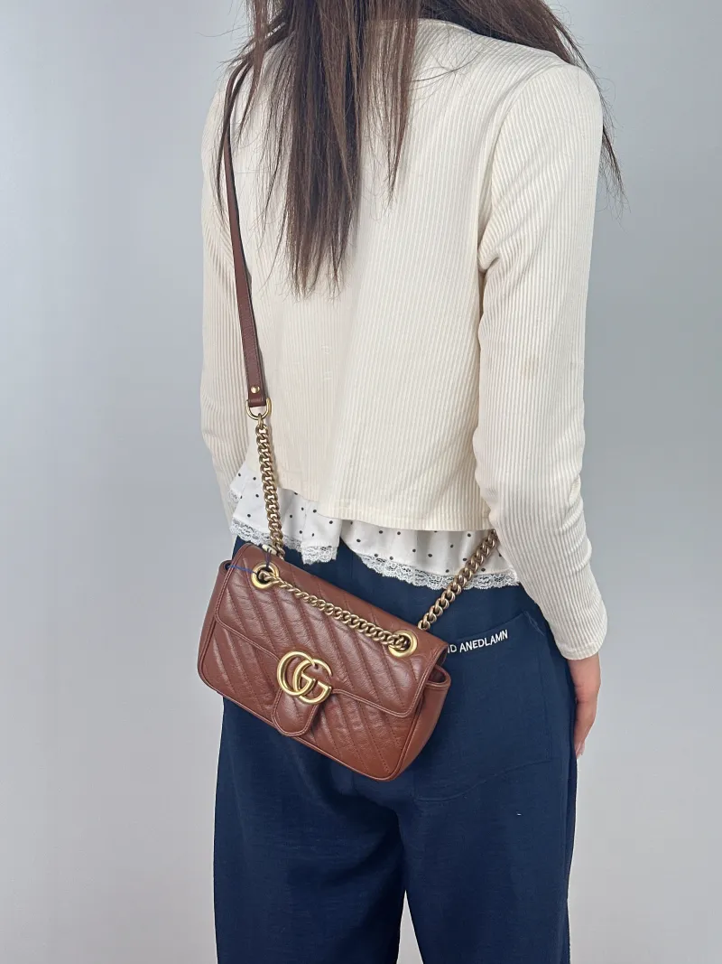 GUCCI Crossbody Bag GG Marmont Small Marmont 22 Caramel Calfskin Small 22 × 6 × 13 cm — on-model view 2 of 2