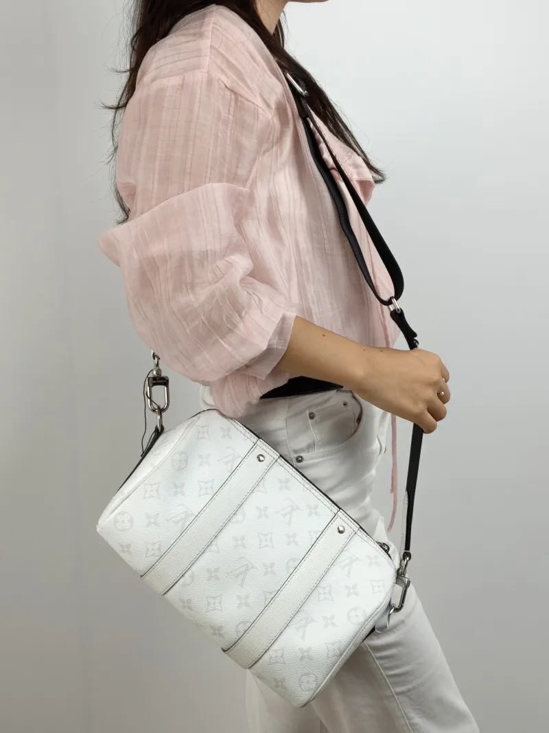 Louis Vuitton Crossbody Bag City Keepall White PVC Medium 27 × 13 × 17 cm — on-model view 2 of 2