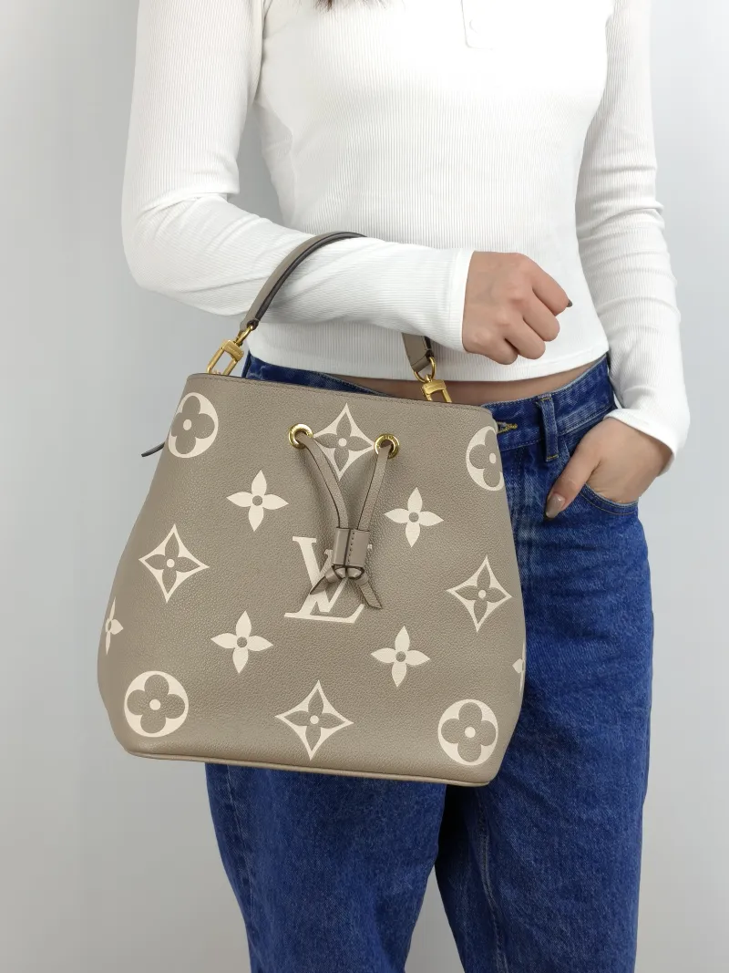 Louis Vuitton Shoulder Bag NÉONOÉ Bucket Bag · White Monogram Empreinte Embossed Calfskin Medium 26 × 17.5 × 26 cm — on-model view 2 of 2