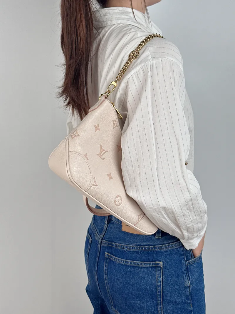 Louis Vuitton Crossbody Bag Boulogne Beige Monogram Empreinte Embossed Calfskin Small 26 × 9.5 × 16 cm — on-model view 1 of 2