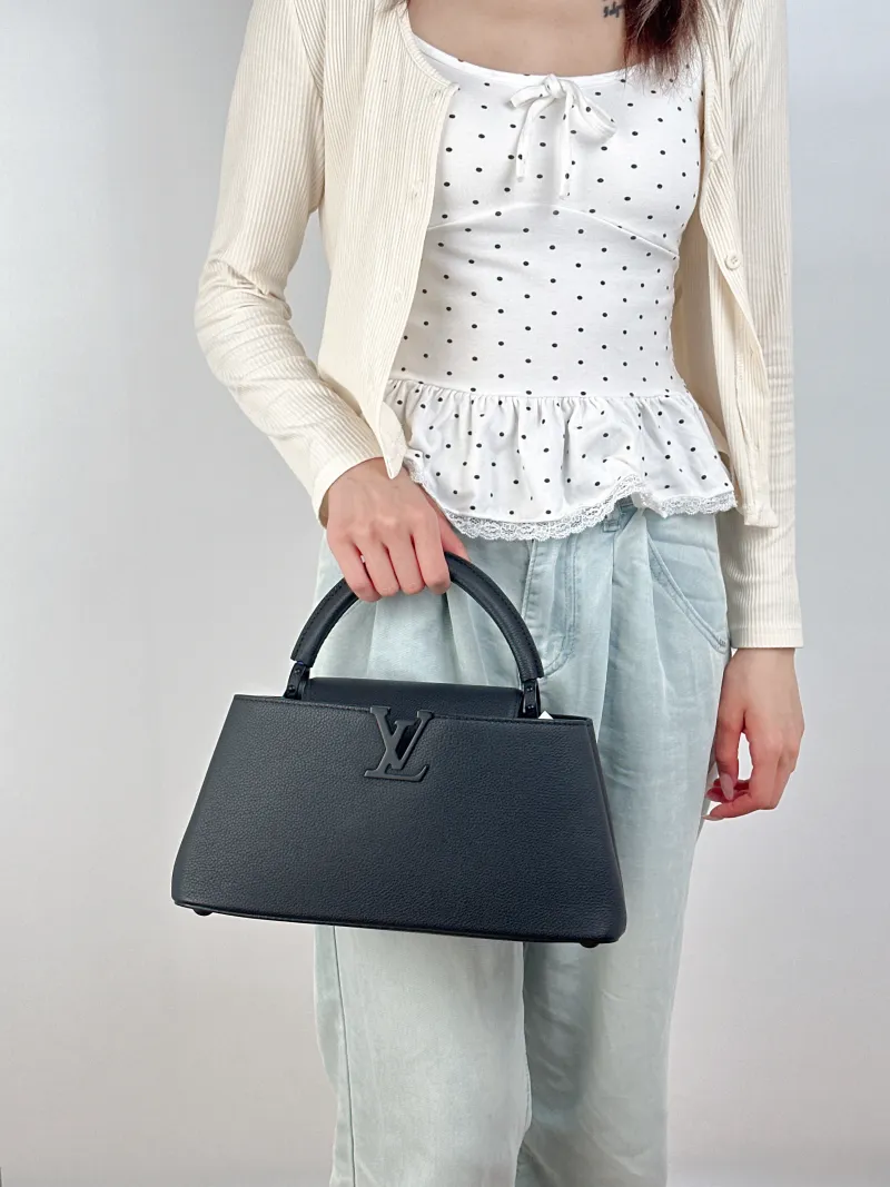 Louis Vuitton Top Handle Bag Capucines East West Black Calfskin Medium33 × 9 × 19 cm — on-model view 3 of 3