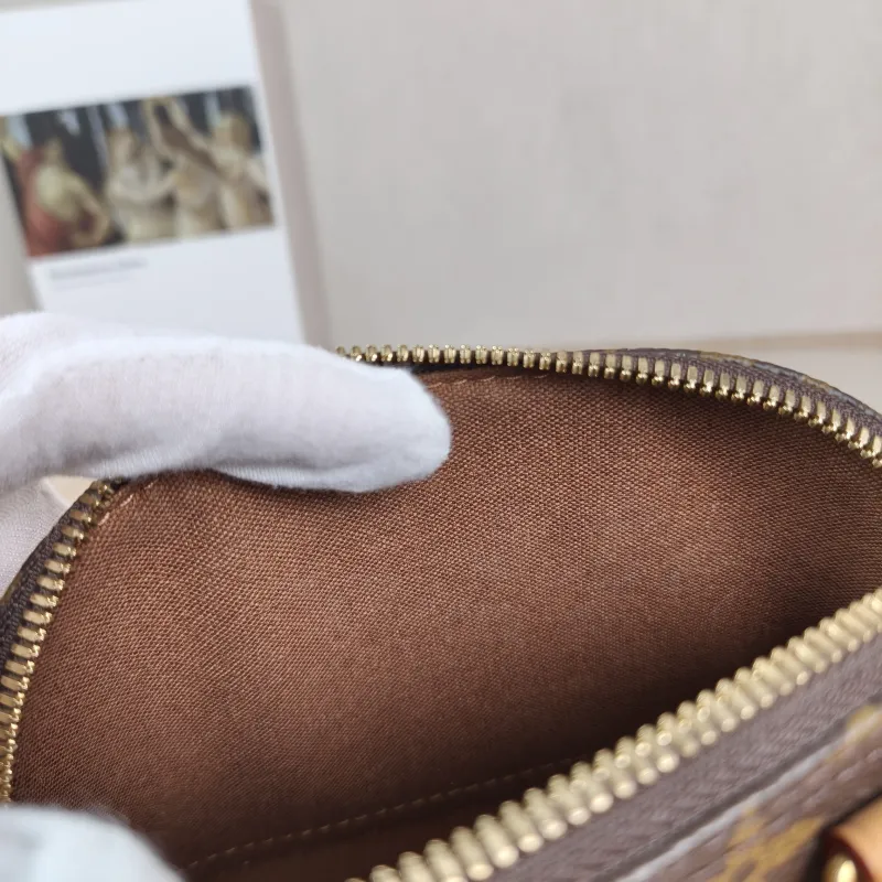 Louis Vuitton Crossbody Bag Alma Nano Monogram PVC nano 18 × 8 × 12 cm — detail view 1 of 10