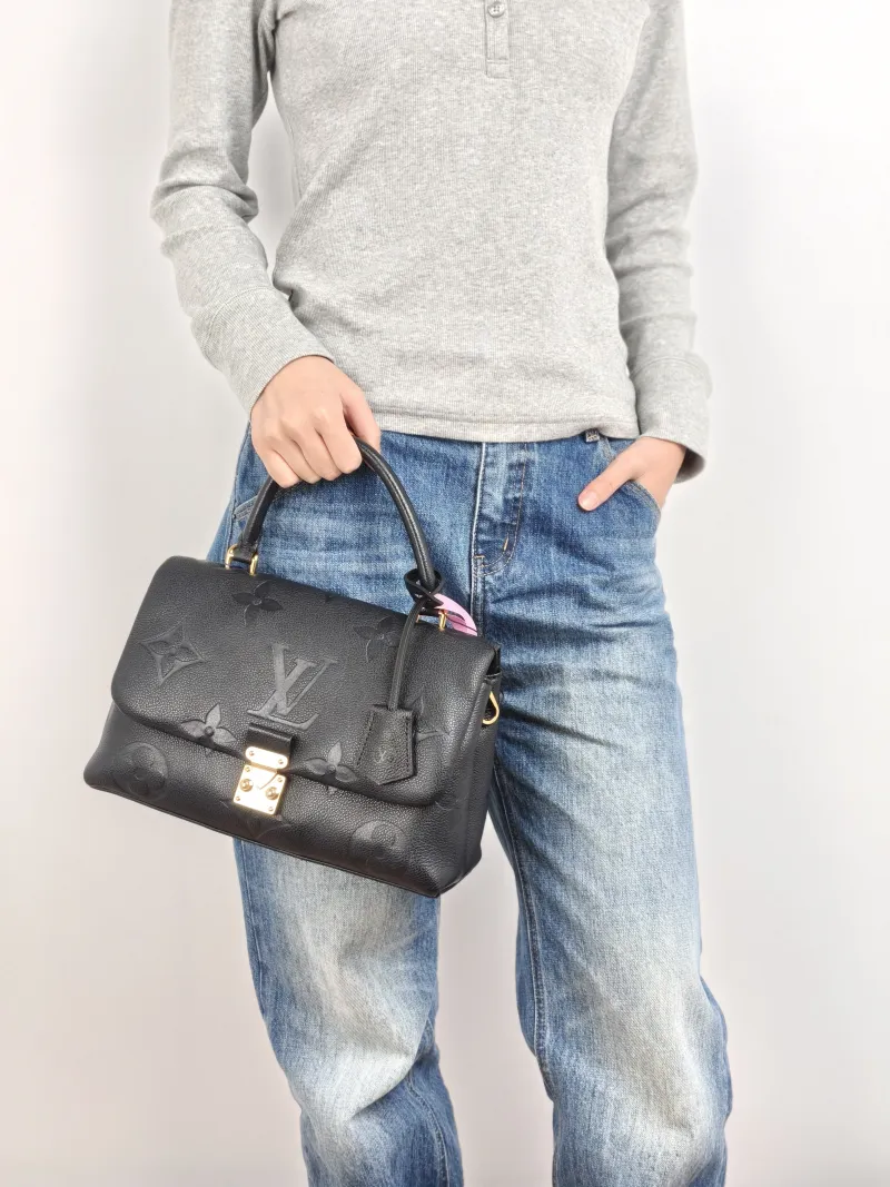 Louis Vuitton Crossbody Bag MADELEINE Black Monogram Empreinte Embossed Calfskin Medium 30 × 11 × 19.5 cm — on-model view 2 of 3