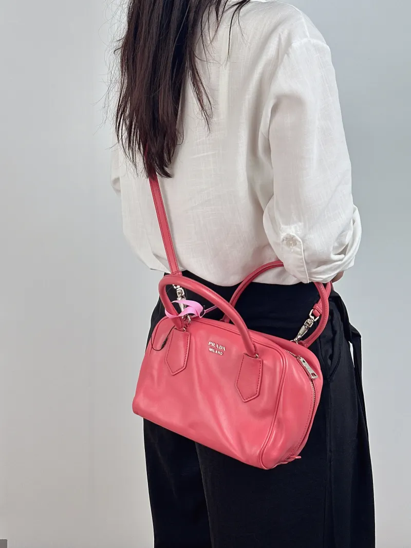PRADA Crossbody Bag Crossbody Bag Pink Calfskin One Size 22 × 13 × 16 cm — on-model view 1 of 2