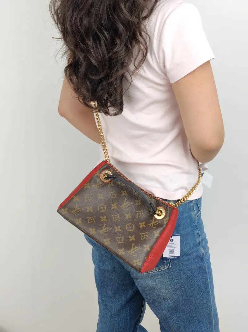 Louis Vuitton Crossbody Bag Surène BB Chain Bag Red Monogram PVC · Calfskin BB 24 × 11 × 17 cm — on-model view 1 of 2