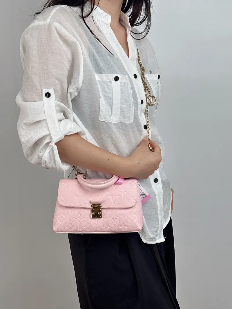 Louis Vuitton Crossbody Bag MADELEINE Pink Calfskin nano 21 × 6 × 12.5 cm — on-model view 2 of 2