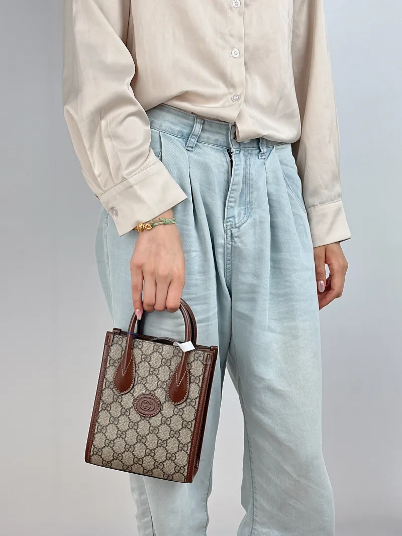 GUCCI Crossbody Bag GG Retro Collection Tote Bag Brown PVC Mini 16 × 7 × 20 cm — on-model view 1 of 2