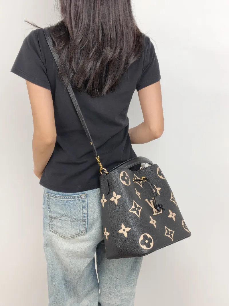 Louis Vuitton Shoulder Bag NÉONOÉ Bucket Bag Black · White Monogram Empreinte Embossed Calfskin Medium 26 × 17.5 × 26 cm — on-model view 1 of 3