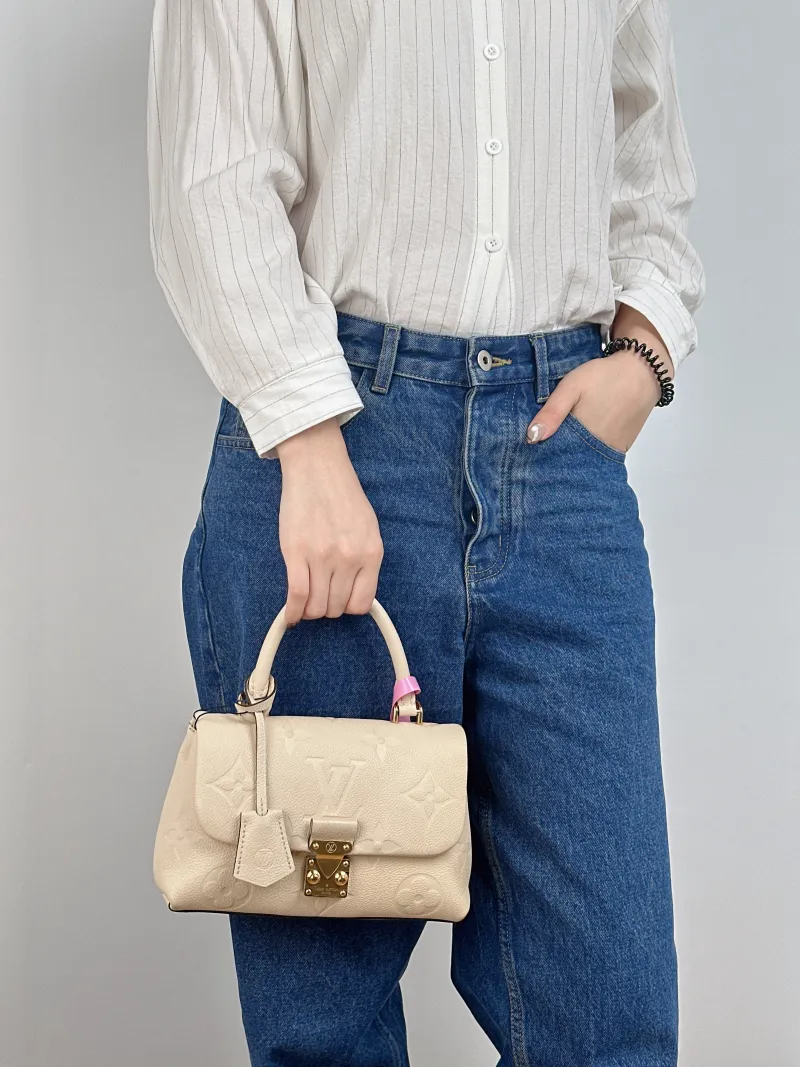 Louis Vuitton Crossbody Bag MADELEINE Beige Monogram Empreinte Embossed Calfskin BB 24 × 8.5 × 17 cm — on-model view 3 of 3
