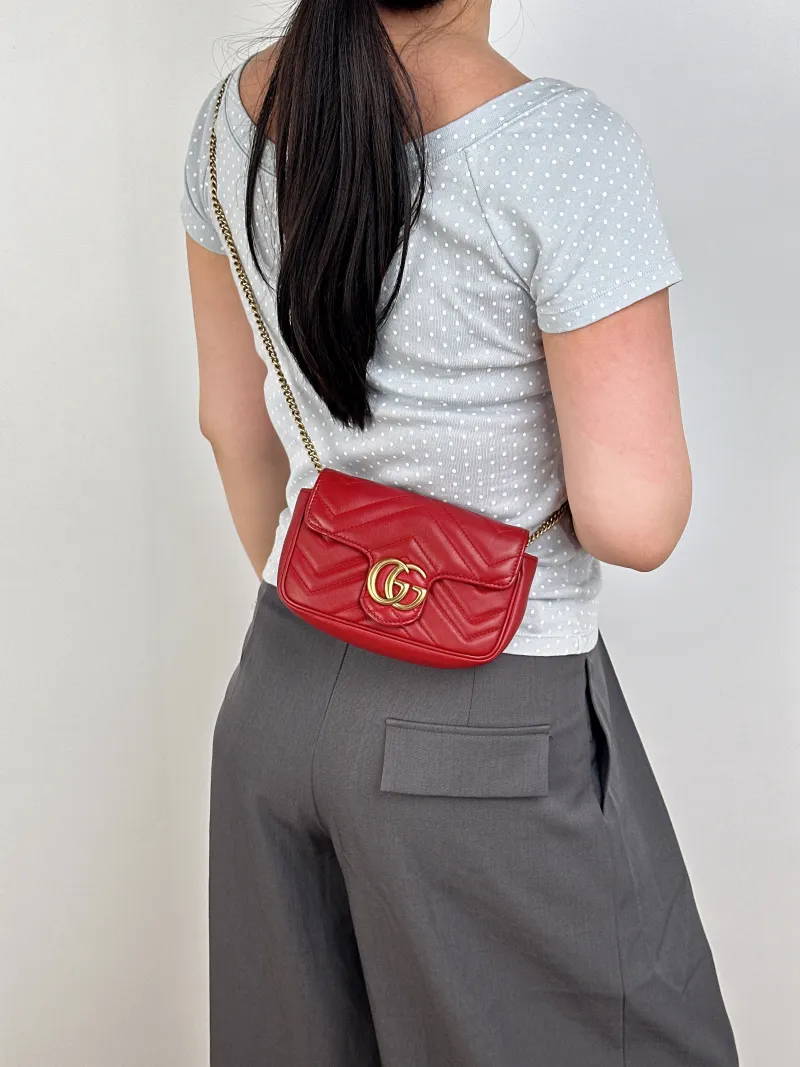 GUCCI Crossbody Bag GG Marmont Mini Marmont Mini Red Calfskinmini16.5 × 4.5 × 9.5 cm — on-model view 1 of 2