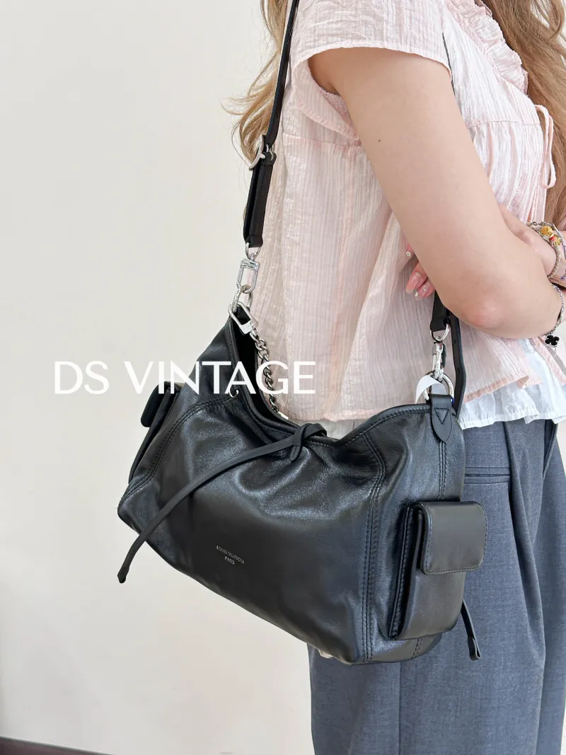 Louis Vuitton Crossbody Bag Carryall Cargo Vibe Black SL ambskin Small 33.5 × 15 × 23 cm — on-model view 1 of 3