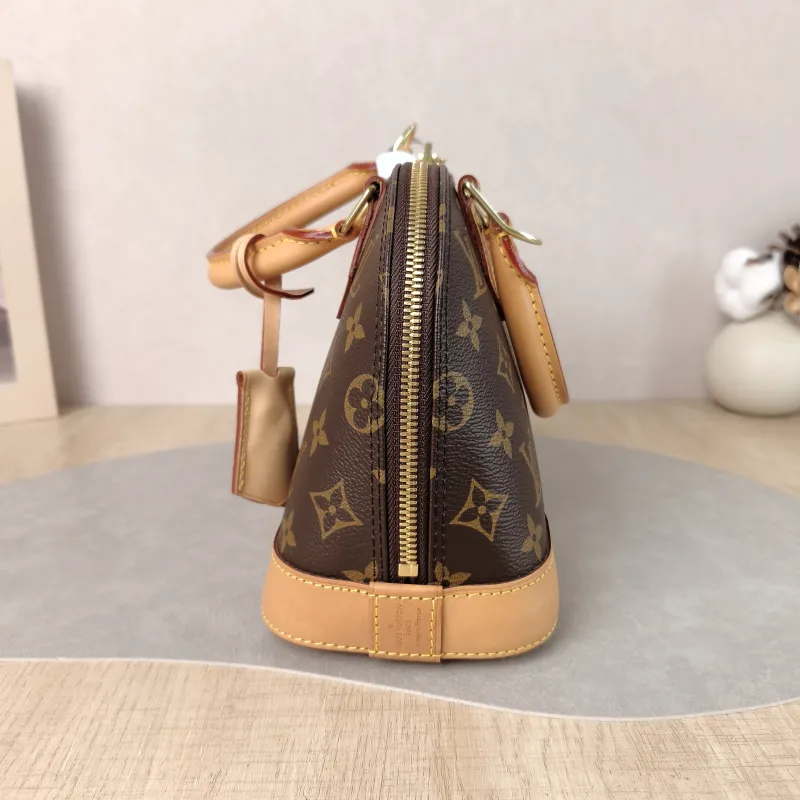 Louis Vuitton Crossbody Bag Alma BB Monogram PVC BB 23.5 × 11.5 × 17.5 cm — detail view 8 of 12