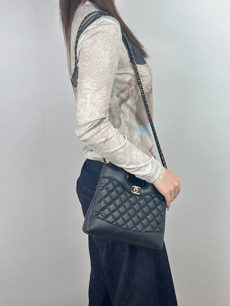 Chanel Crossbody Bag31Bag Black Waxed Leathermini23 × 5.5 × 22 cm — on-model view 2 of 3