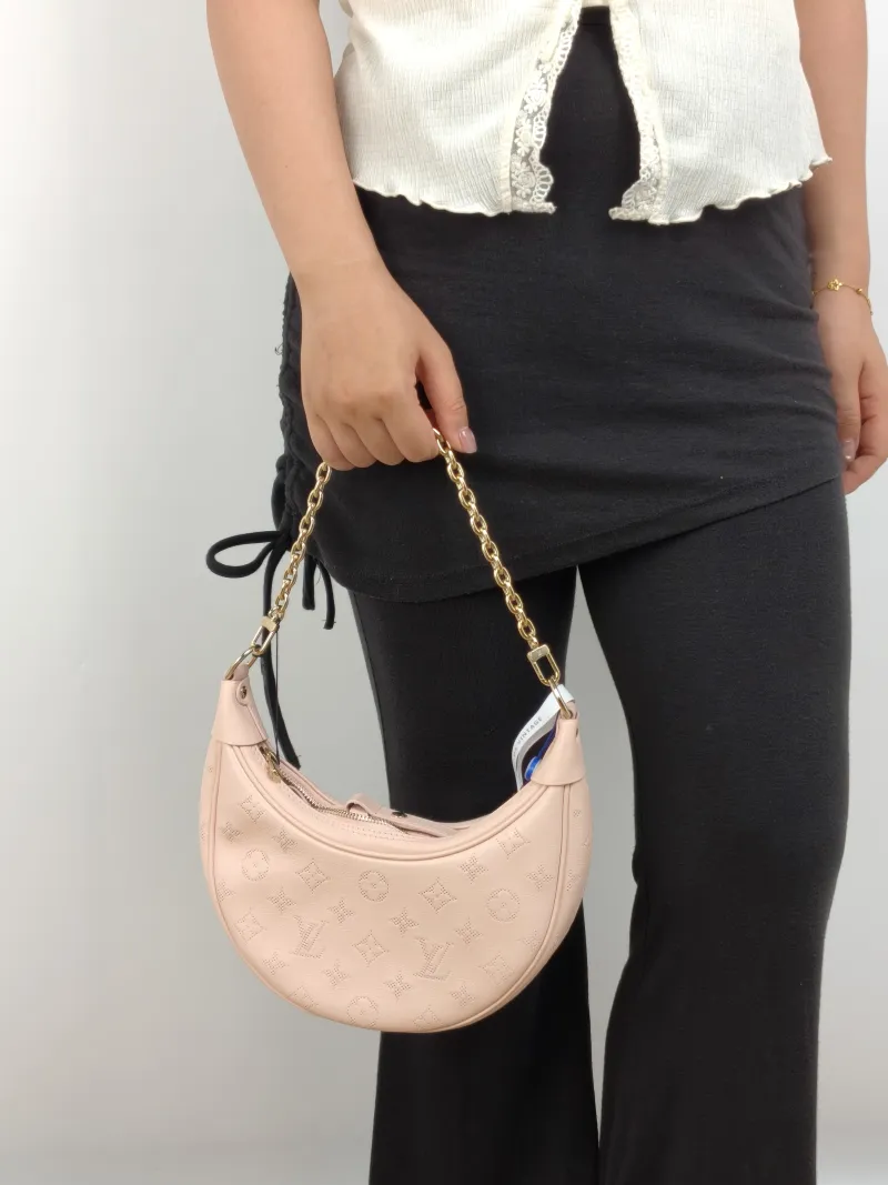 Louis Vuitton Crossbody Bag Loop Pink Calfskin Small 23 × 6 × 13 cm — on-model view 2 of 3