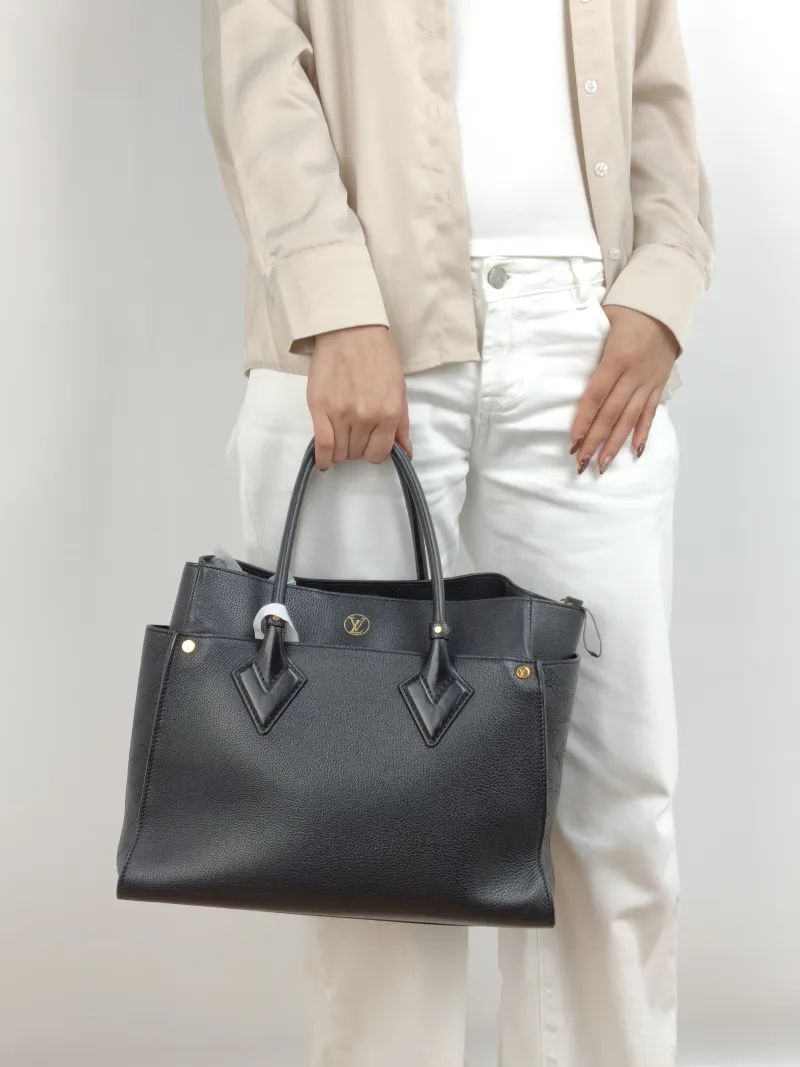 Louis Vuitton Shoulder Bag On My Side Black Calfskin Large 34 × 17 × 28 cm — on-model view 1 of 2
