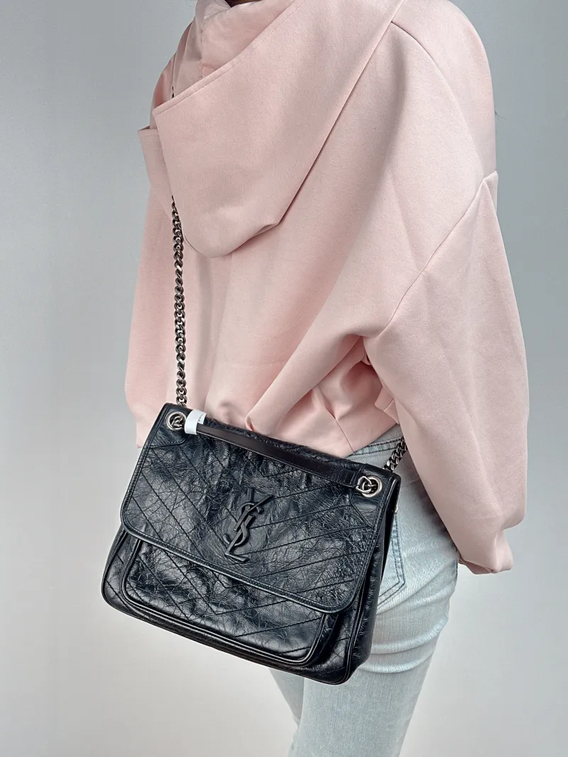 SAINT LAURENT Crossbody Bag Niki D Waxed Leather Calfskin Medium 28 × 8.5 × 20 cm — on-model view 2 of 2
