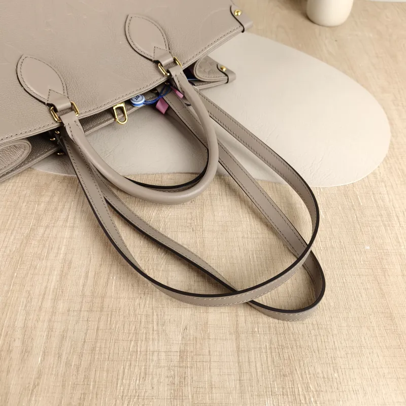 Louis Vuitton Shoulder Bag Onthego Medium Monogram Empreinte Embossed Calfskin Medium 35 × 14 × 27 cm — detail view 8 of 10