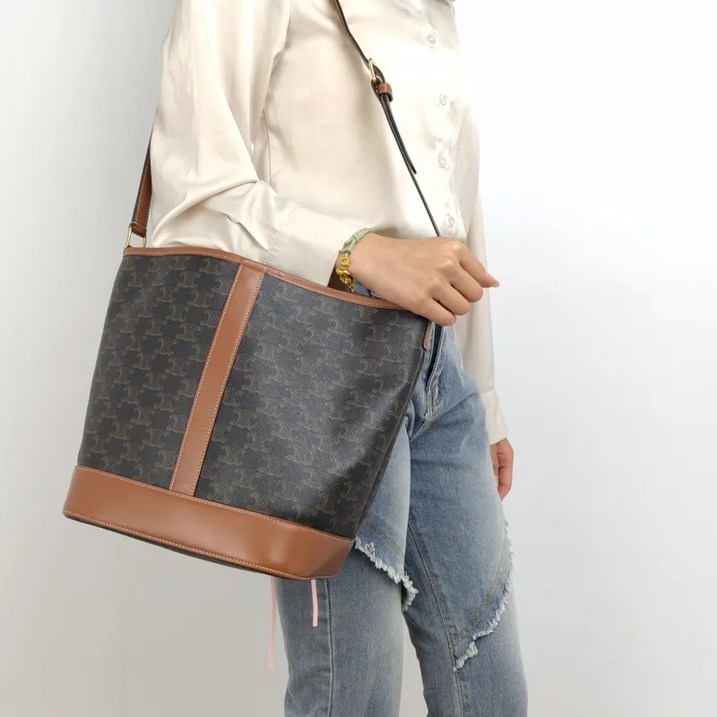 CELINE Crossbody Bag Triomphe Bucket Bag Monogram PVC Medium 24 × 18 × 27 cm — on-model view 2 of 2