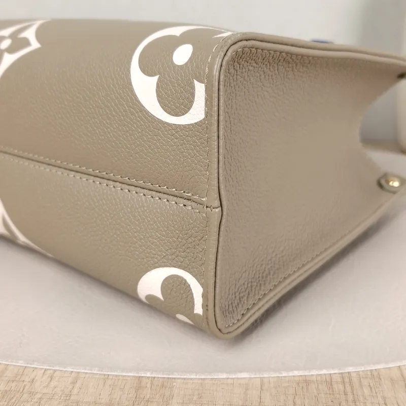 Louis Vuitton Top Handle Bag Onthego Monogram Empreinte Embossed Calfskin Small 25 × 11.5 × 19 cm — detail view 7 of 10