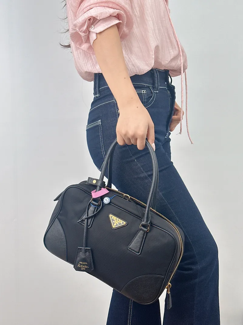 PRADA Top Handle Bag Black Nylon One Size 31 × 9 × 18 cm — on-model view 1 of 2